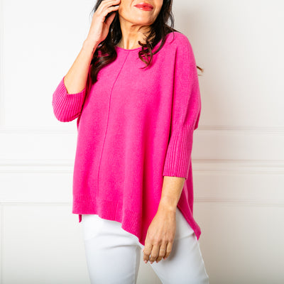 The Fuchsia pink Seam Front Jumper with a round neckline that has a rolled edge