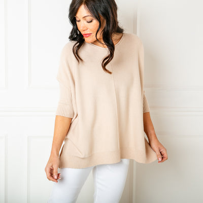 The Seam Front Jumper in oatmeal cream with 3/4 length sleeves that have ribbed detailing around the cuffs