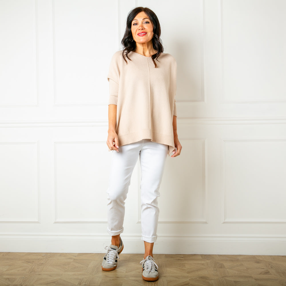 The Oatmeal cream Seam Front Jumper with a round neckline that has a rolled edge