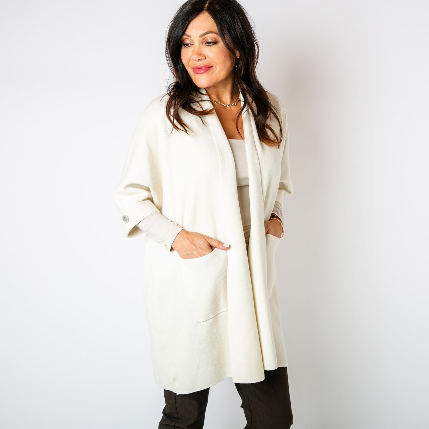 The cream Shawl Button Cardigan with 3/4 length sleeves featuring a button detail 