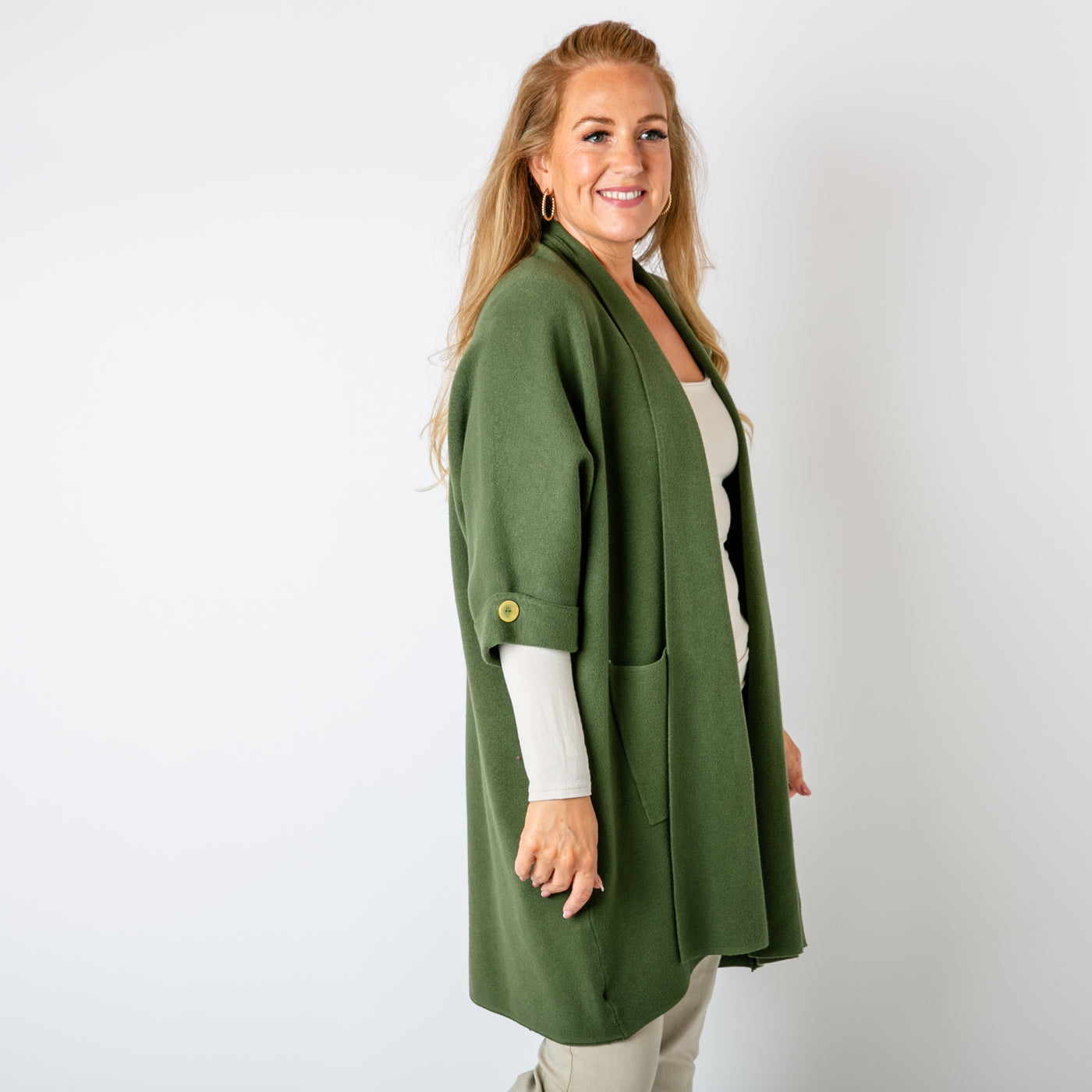 The khaki green Shawl Button Cardigan with 3/4 length sleeves featuring a button detail 