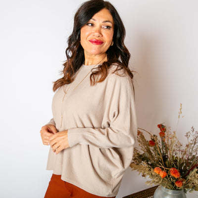 The stone cream Shimmer Batwing Jumper with a relaxed batwing sleeve