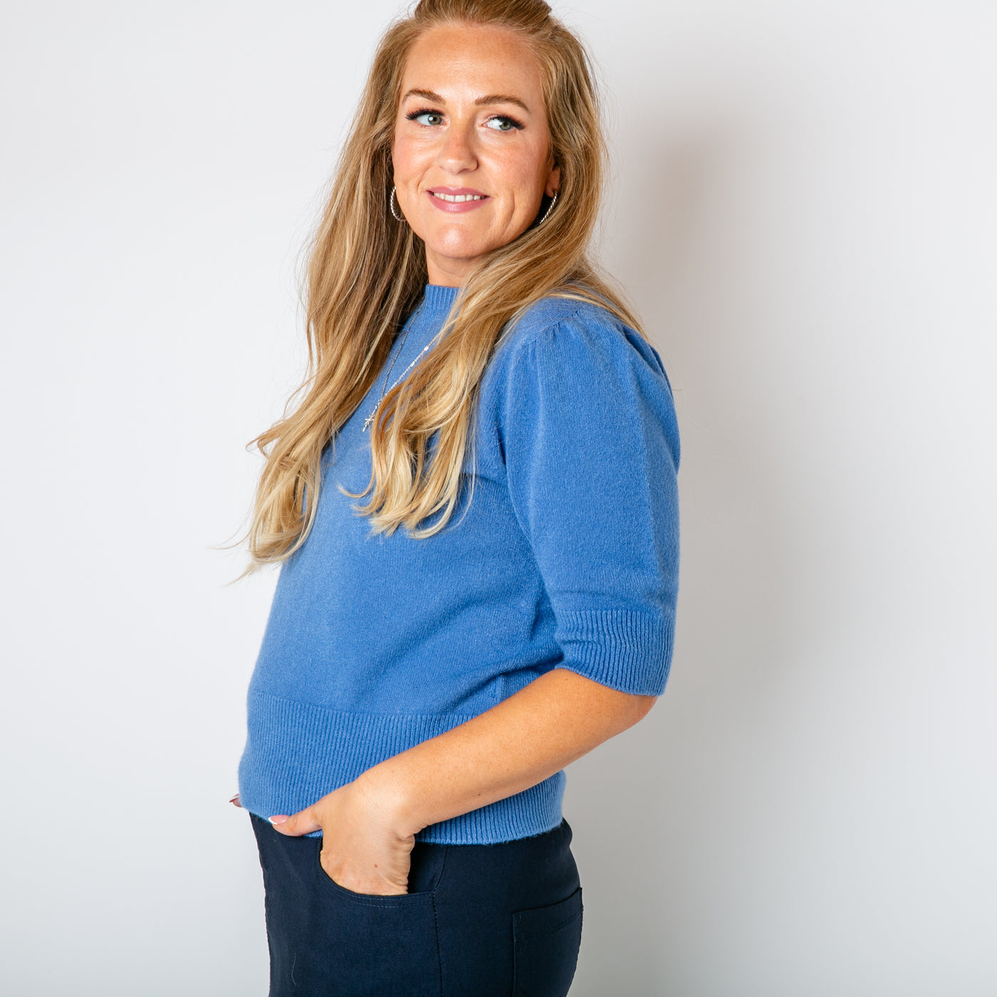 The denim blue Short Puff Sleeve Jumper with sleeves that fall to the elbow and have a gathered detail on the shoulders