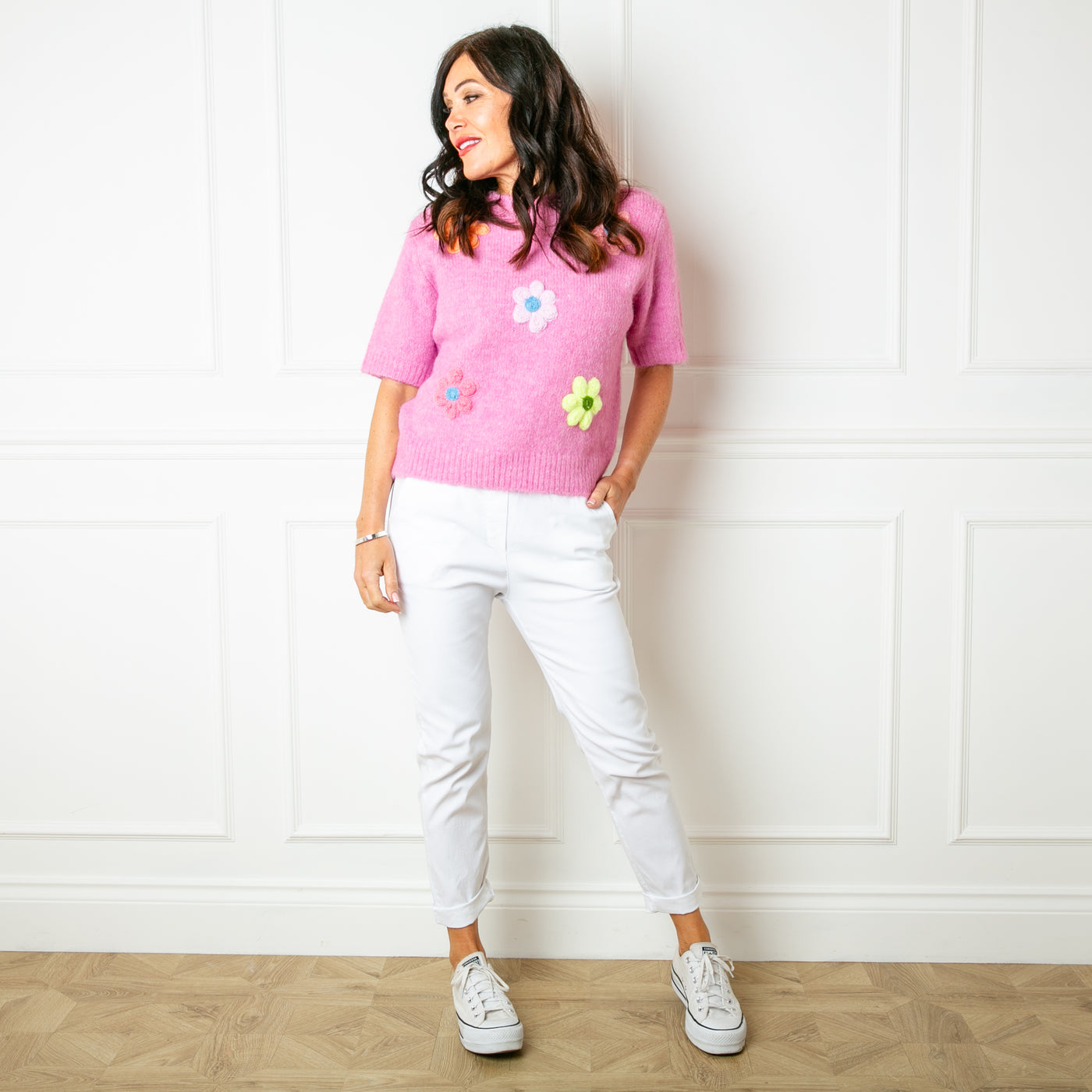 The baby pink Short Sleeve Daisy Jumper with knitted flowers across the front 