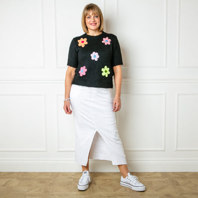The black Short Sleeve Daisy Jumper with knitted flowers across the front 