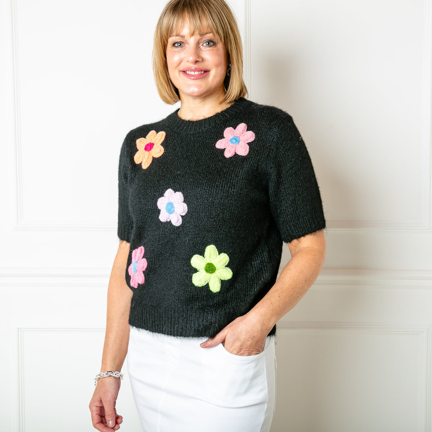 The black Short Sleeve Daisy Jumper made from a blend of cotton and acrylic and perfect for spring