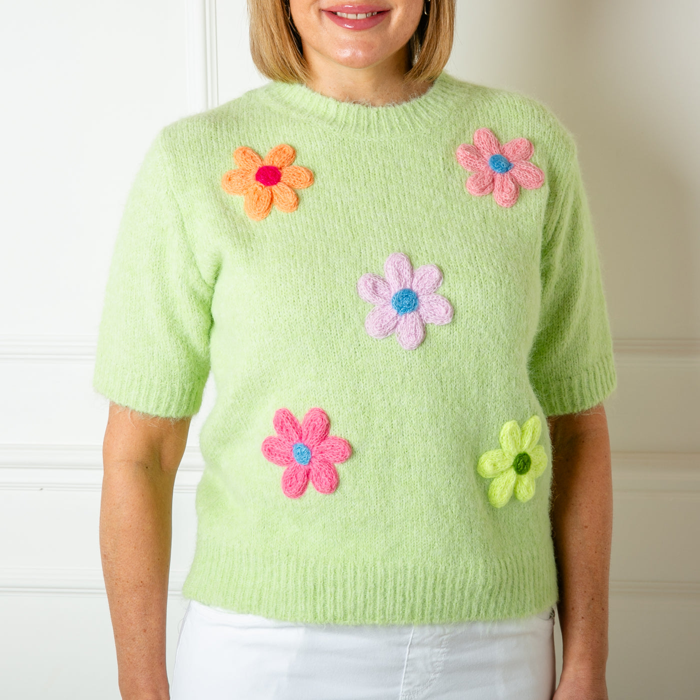 The green Short Sleeve Daisy Jumper with 3/4 length sleeves and a round neckline