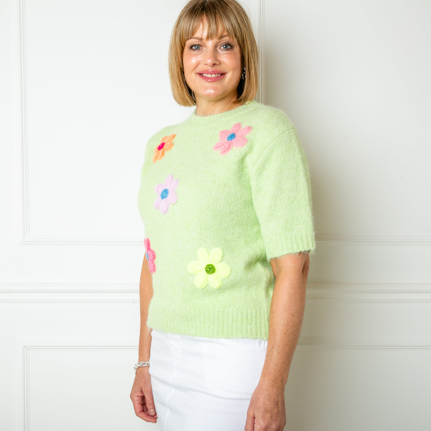 The green Short Sleeve Daisy Jumper made from a blend of cotton and acrylic and perfect for spring