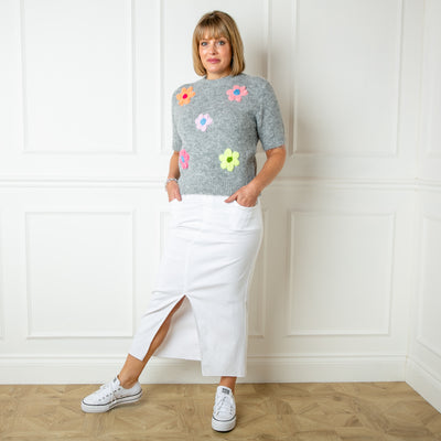 The grey Short Sleeve Daisy Jumper with knitted flowers across the front 