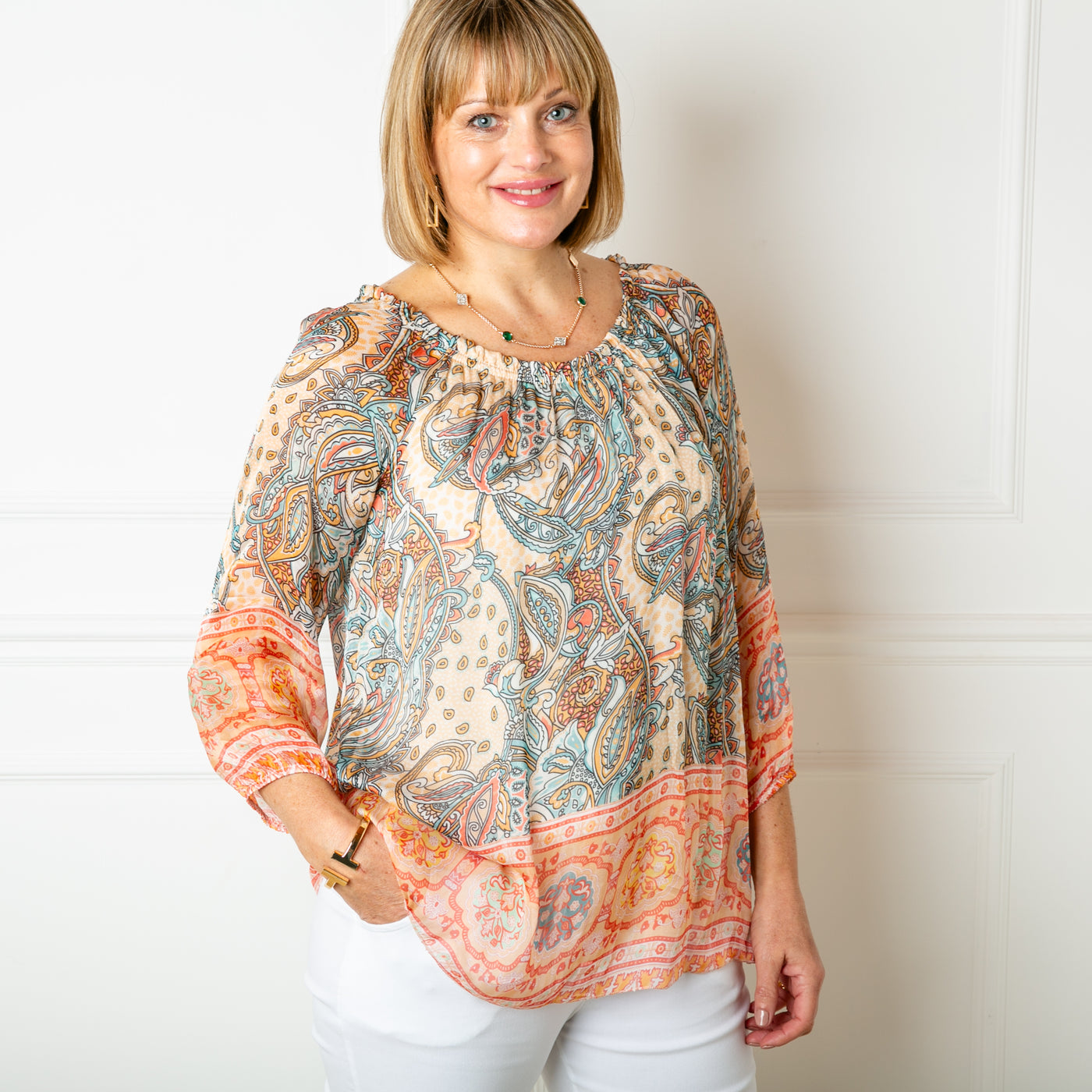 The cream Silk Blend Paisley Top with 3/4 length sleeves with elastic around the cuffs