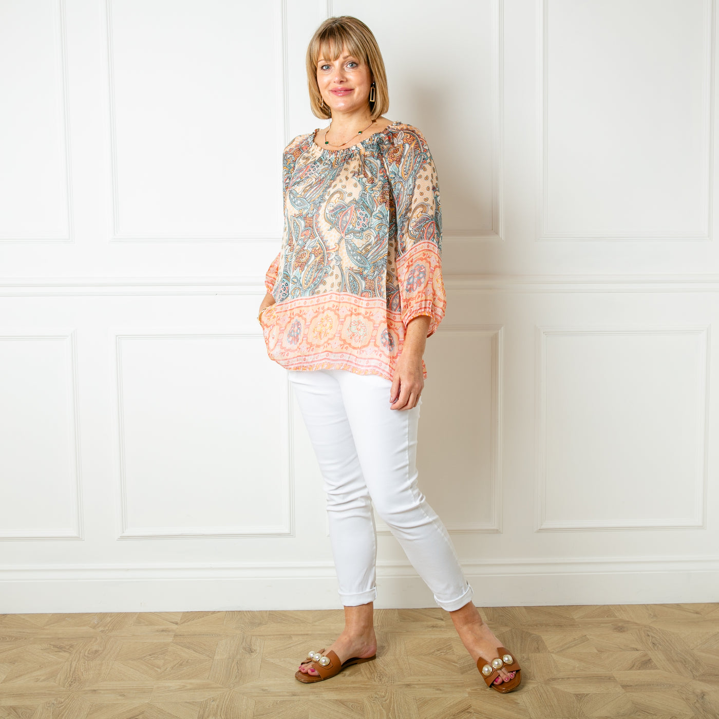 The cream Silk Blend Paisley Top in a beautiful, intrciate paisley print with a stretchy lining underneath