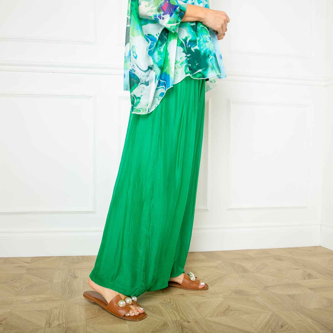 The emerald green Silk Blend Trousers with a wide stretchy waistband that can be folded over