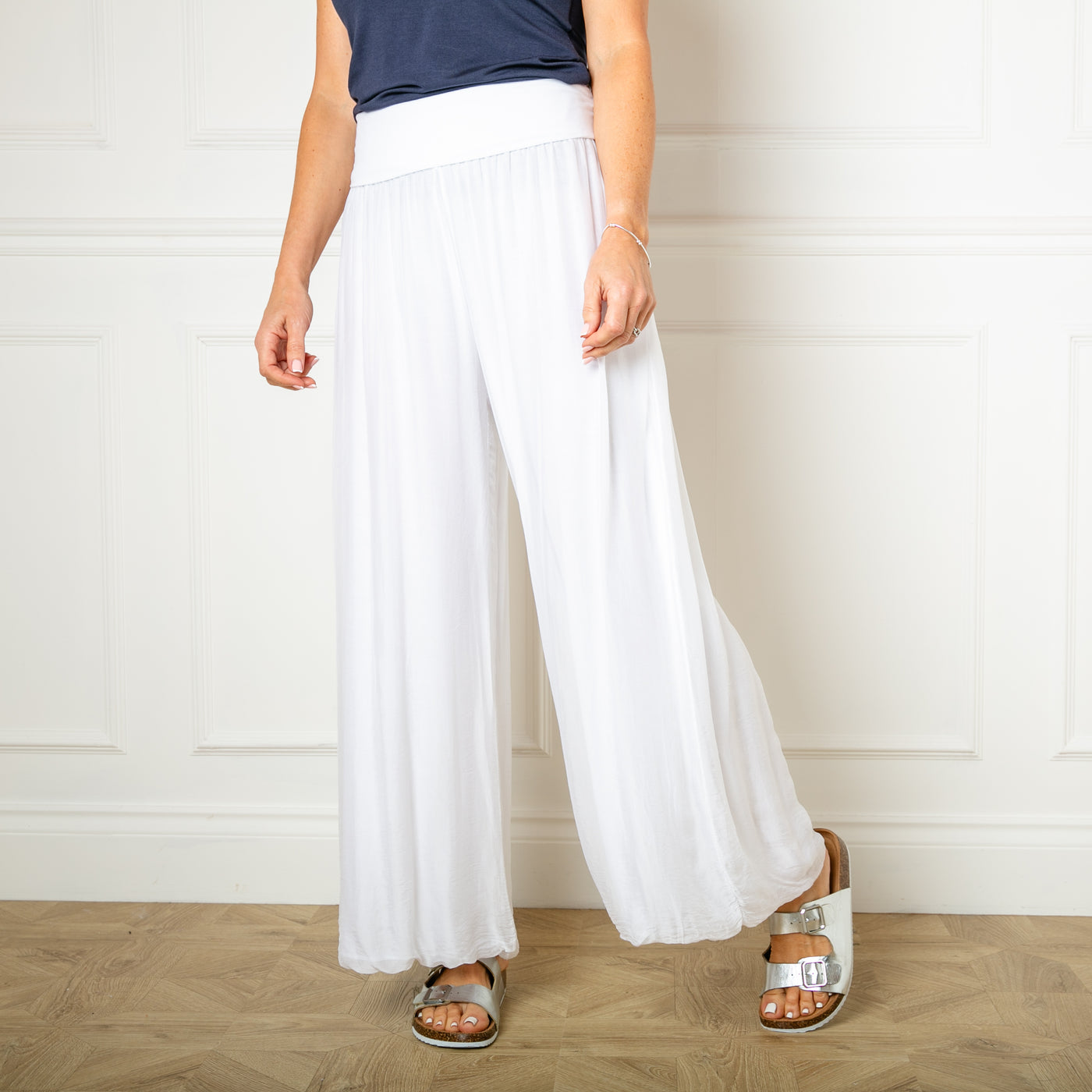 The white Silk Blend Trousers, made from a beautiful silk material with a stretchy jersey lining underneath