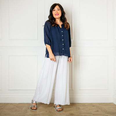 The white Silk Blend Trousers with a wide stretchy waistband that can be folded over