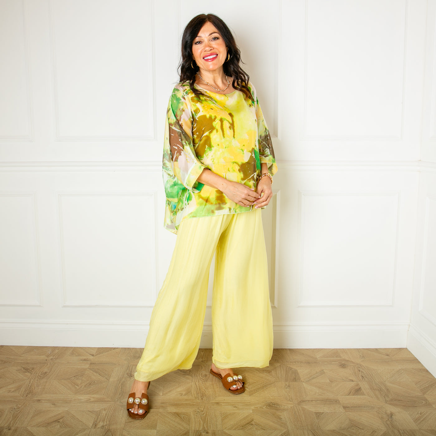 The yellow Silk Blend Trousers with a wide stretchy waistband that can be folded over