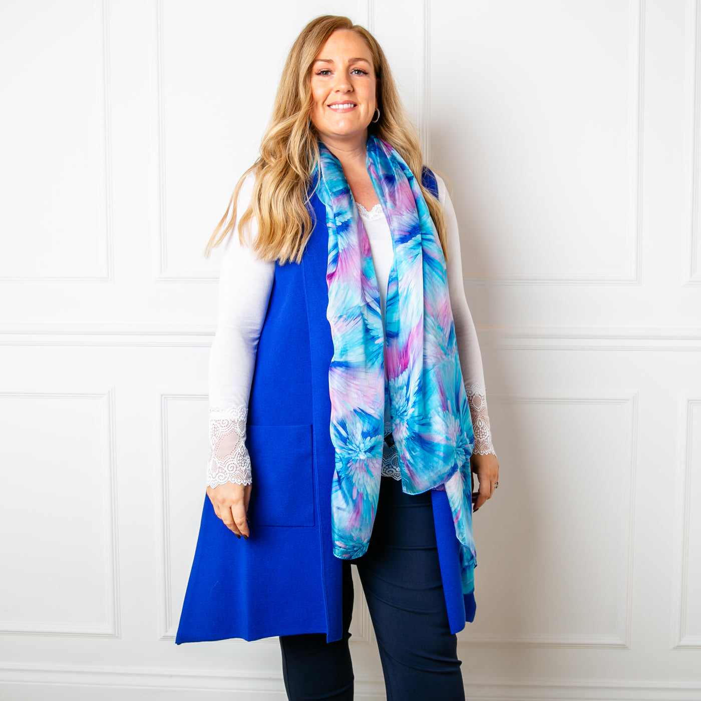 The Sleeveless Cardigan in royal blue with side pockets for added comfort