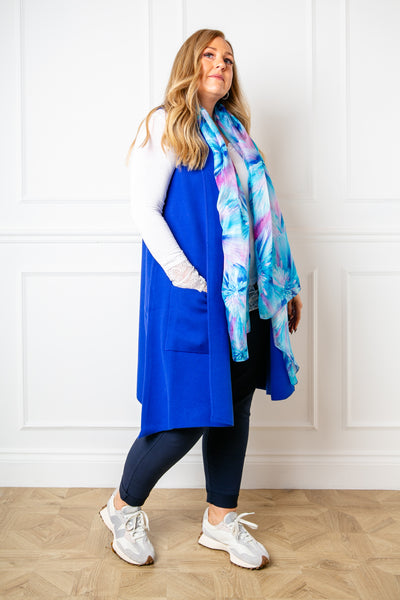 The Sleeveless Cardigan in royal blue which falls to just above the knee