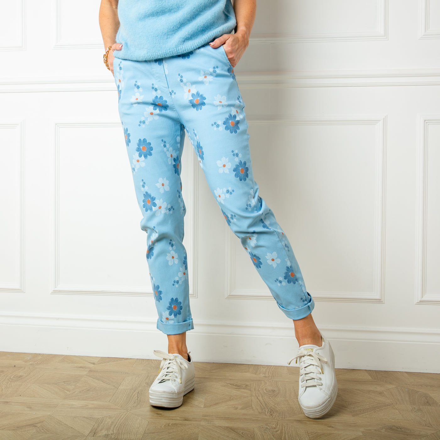 The baby blue Slim Fit Floral Trousers with pockets in either side