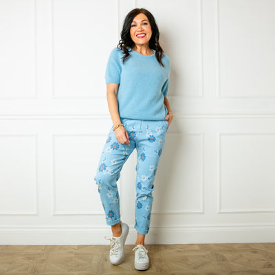 The baby blue Slim Fit Floral Trousers with an elasticated drawstring waistband for added stretch and comfort