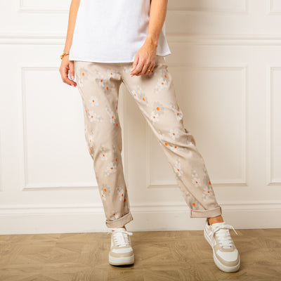 The stone cream Slim Fit Floral Trousers with pockets in either side