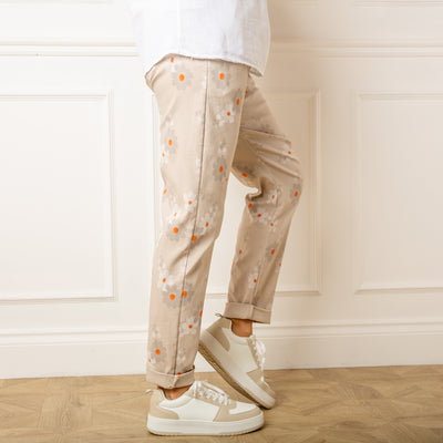 The stone cream Slim Fit Floral Trousers with an elasticated drawstring waistband for added stretch and comfort