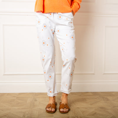 The white Slim Fit Floral Trousers with pockets in either side
