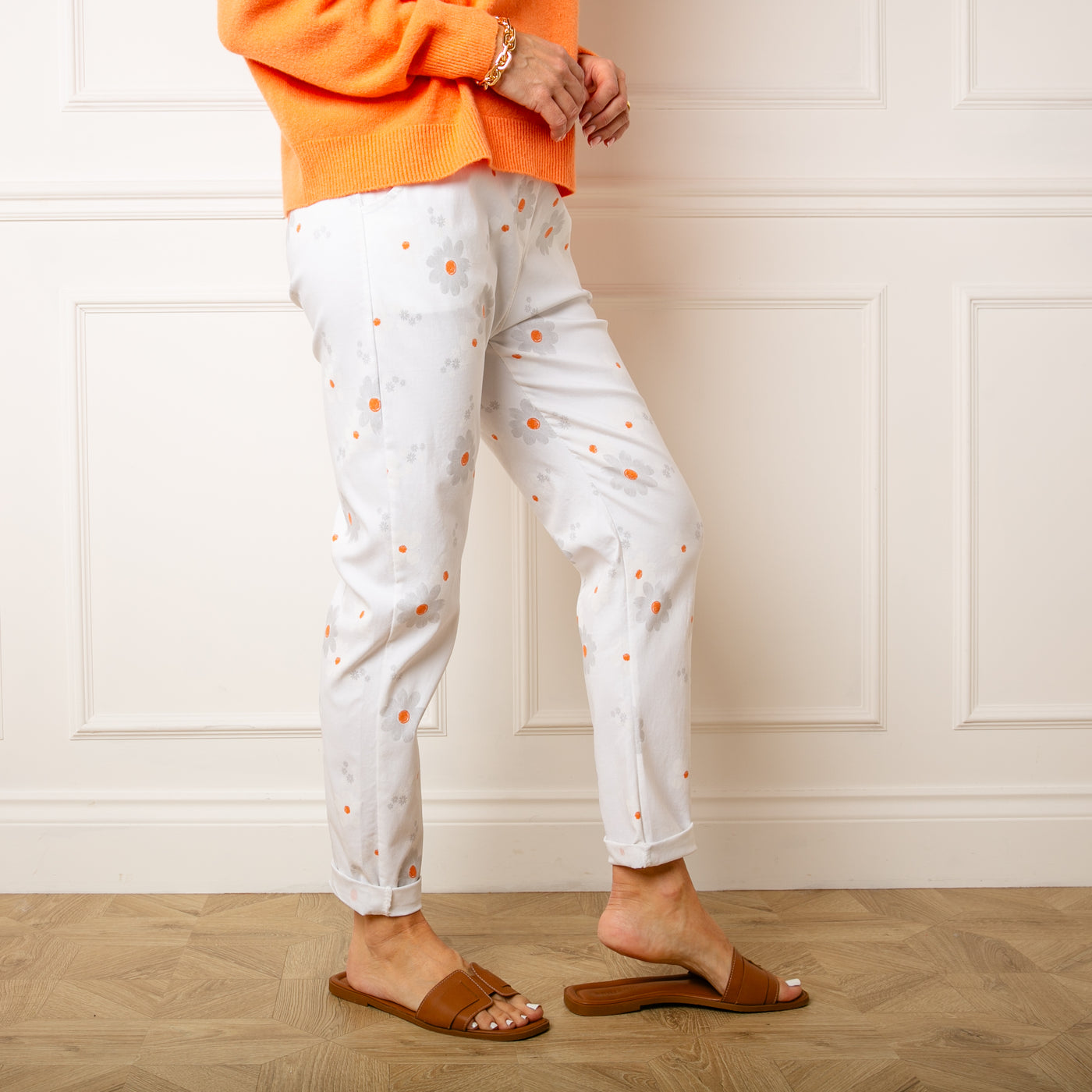 The white Slim Fit Floral Trousers made from a super stretchy blend of viscose nylon and spandex