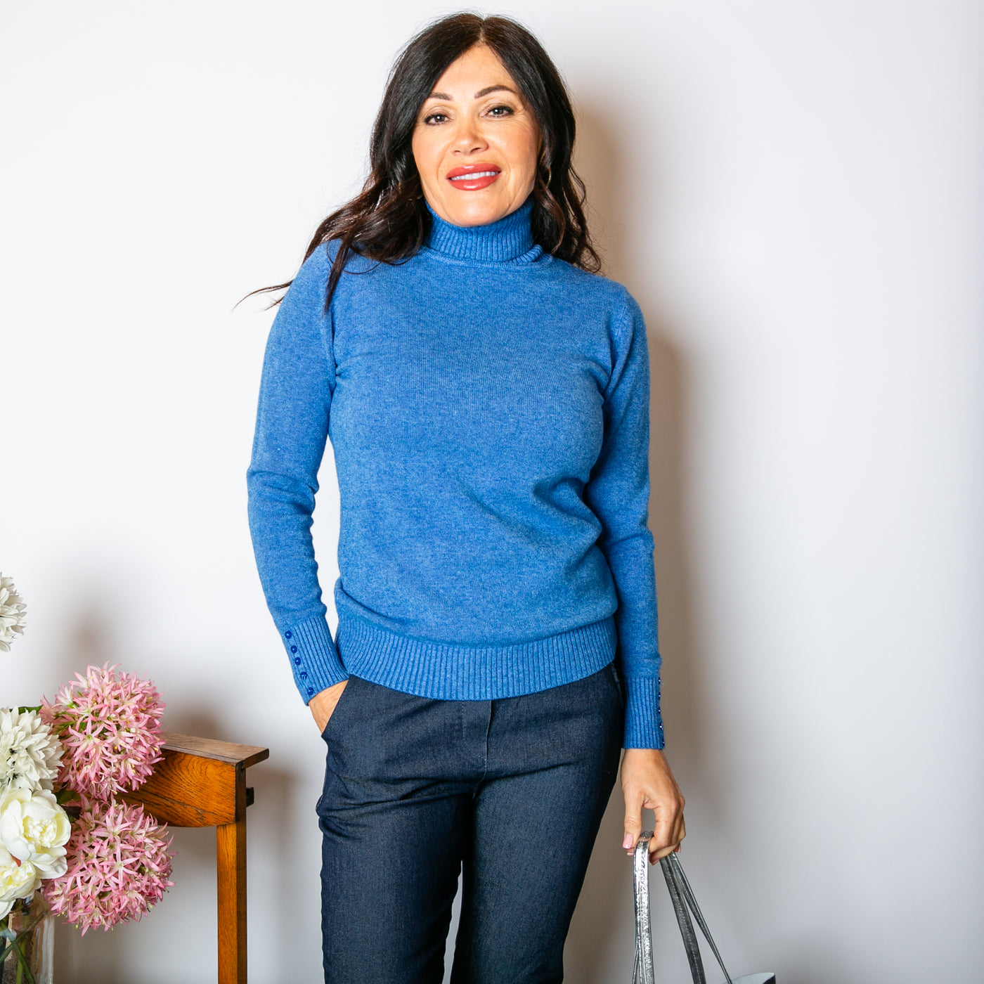 Slim Fit Roll Neck Jumper in denim blue with long sleeves that have ribbed cuffs with a button detail