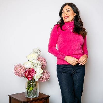 Slim Fit Roll Neck Jumper in fuchsia pink with long sleeves that have ribbed cuffs with a button detail