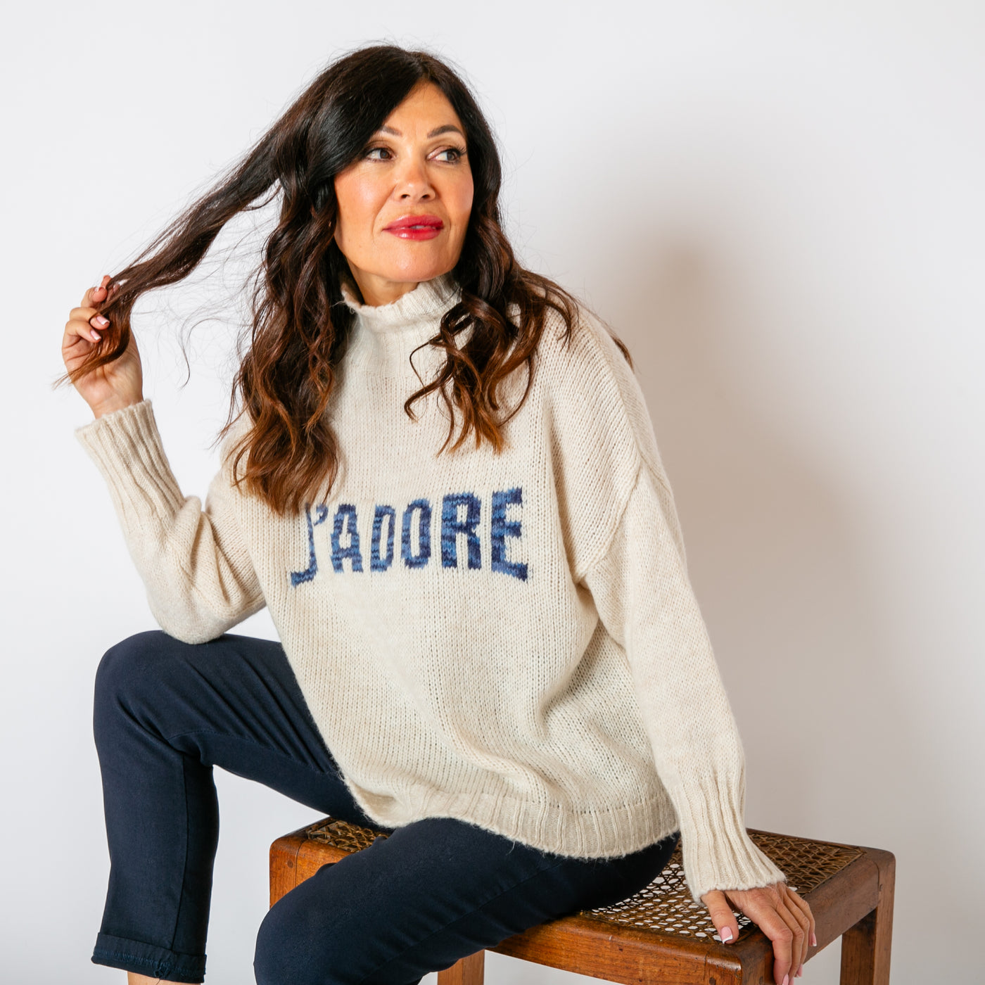 The cream Slogan Wool Blend Jumper with blue writing across the front