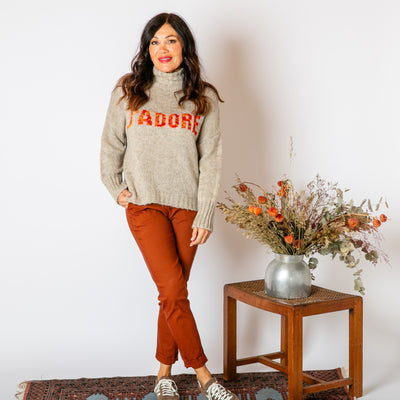 The taupe brown Slogan Wool Blend Jumper with long sleeves and a high neckline