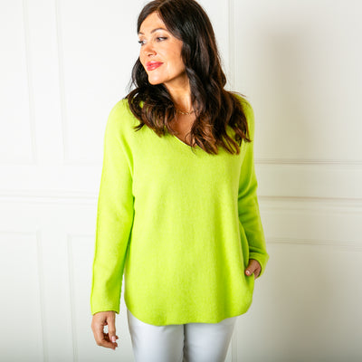 The chartreuse green Soft V Neck Jumper with long sleeves and statement seam detailing from the shoulder down