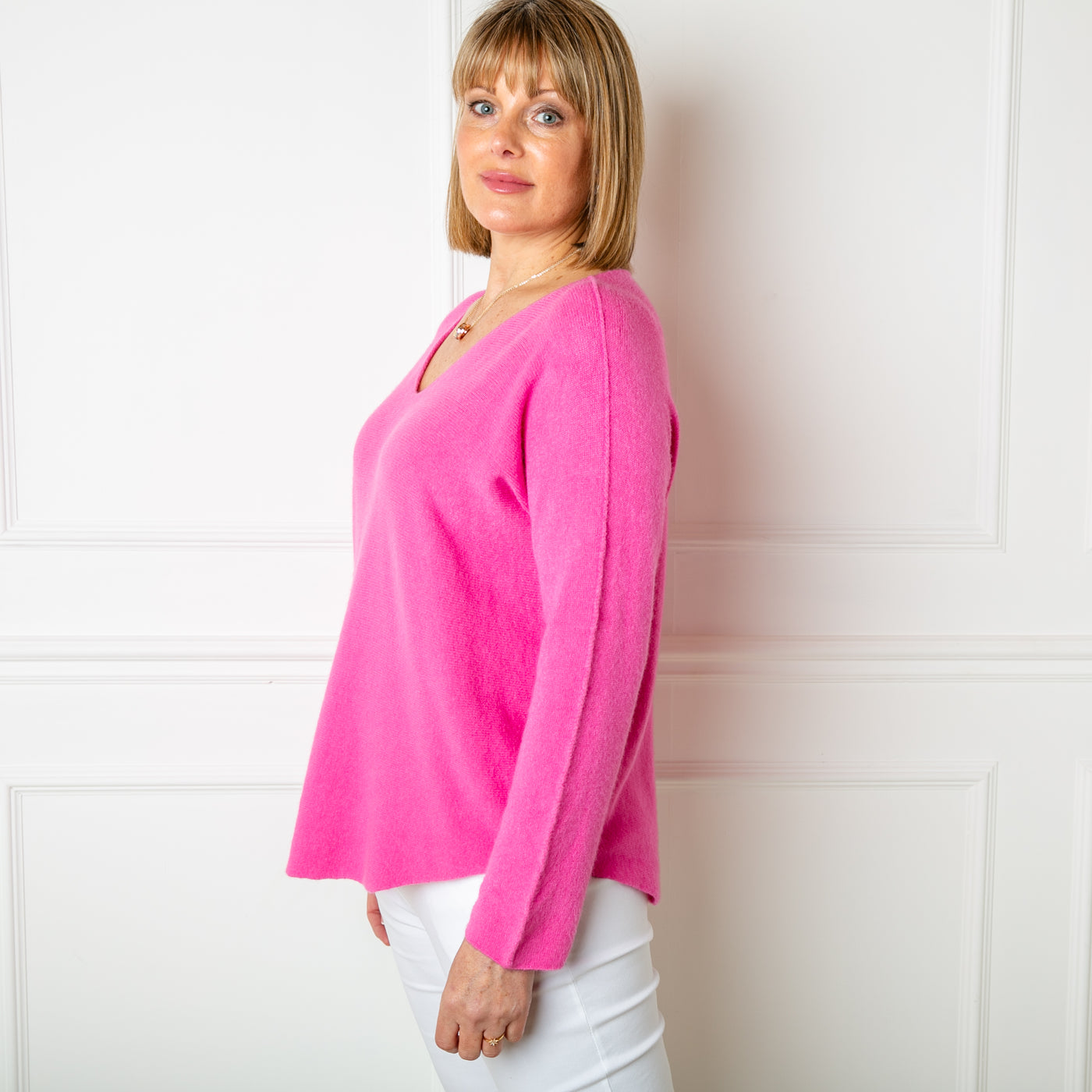 The fuchsia pink Soft V Neck Jumper made from a super soft fine knitted blend material