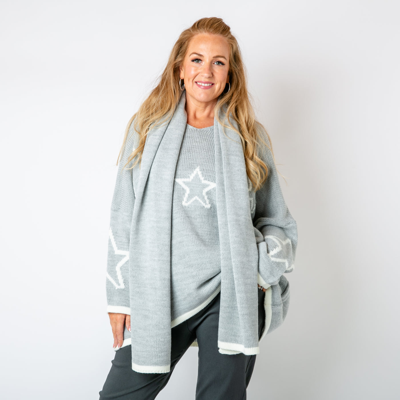 The grey Star Jumper & Scarf with a matching knitted jumper and scarf in the same colour