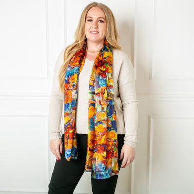 The Starfruit silk scarf featuring a vibrant abstract pattern 