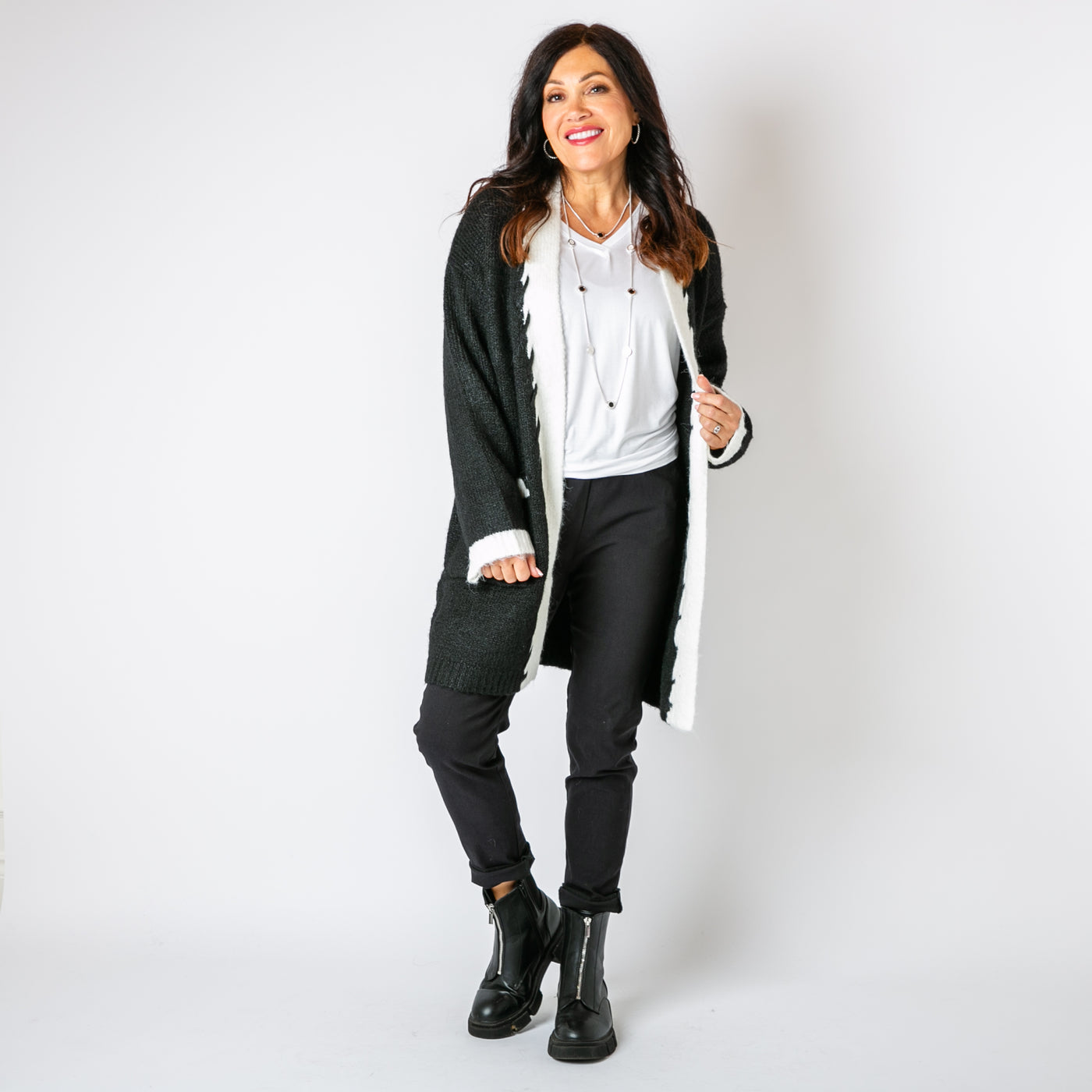 The black Stitch Edge Cardigan with contrasting with long sleeves and an open front