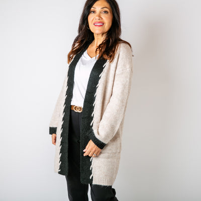 The cream Stitch Edge Cardigan with contrasting with long sleeves and an open front