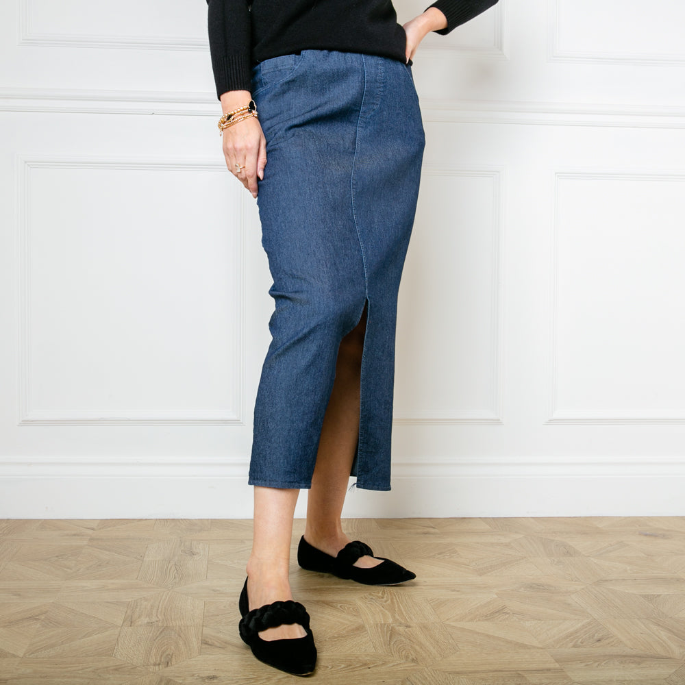 The Stretch Midi Skirt in denim dark blue made from a stretchy fabric with a denim effect