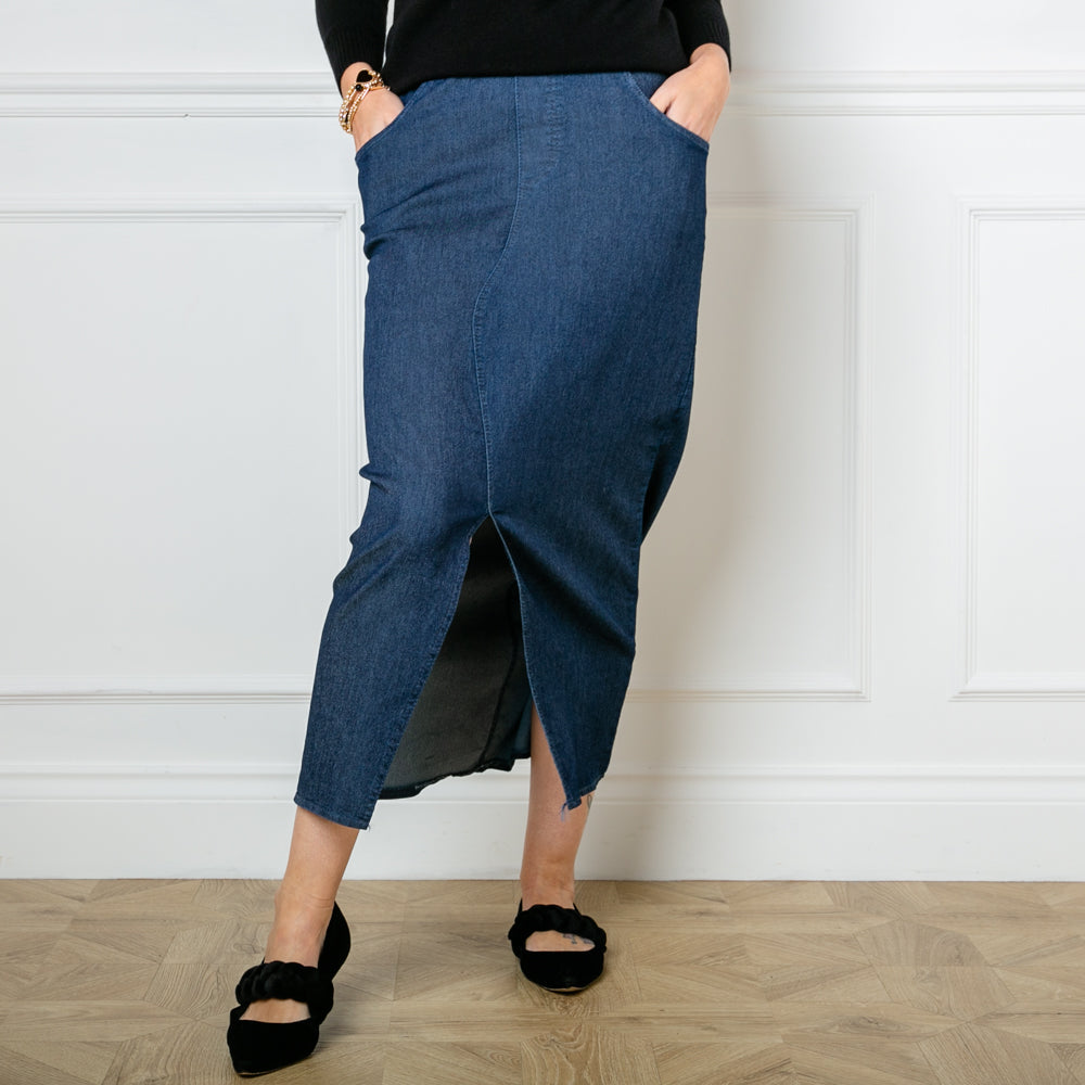 The Stretch Midi Skirt in denim dark blue in a midi length with a split down the front 