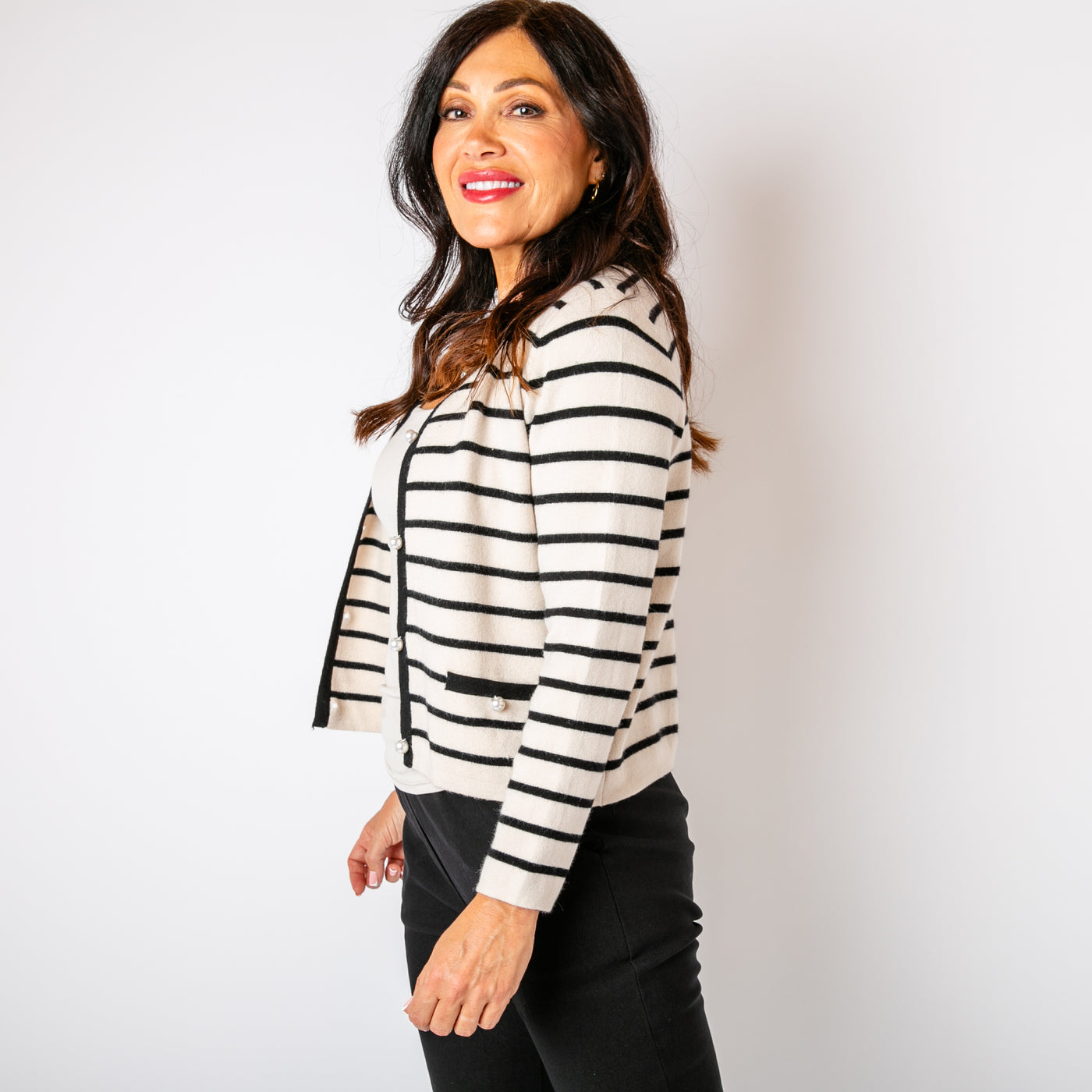 The Cream Stripy Pearl Cardigan long sleeves and pockets on either side of the waist