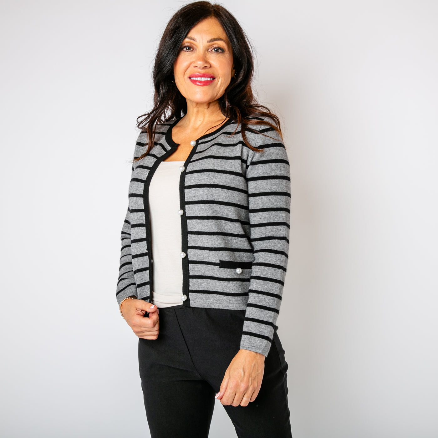 The grey Stripy Pearl Cardigan long sleeves and pockets on either side of the waist