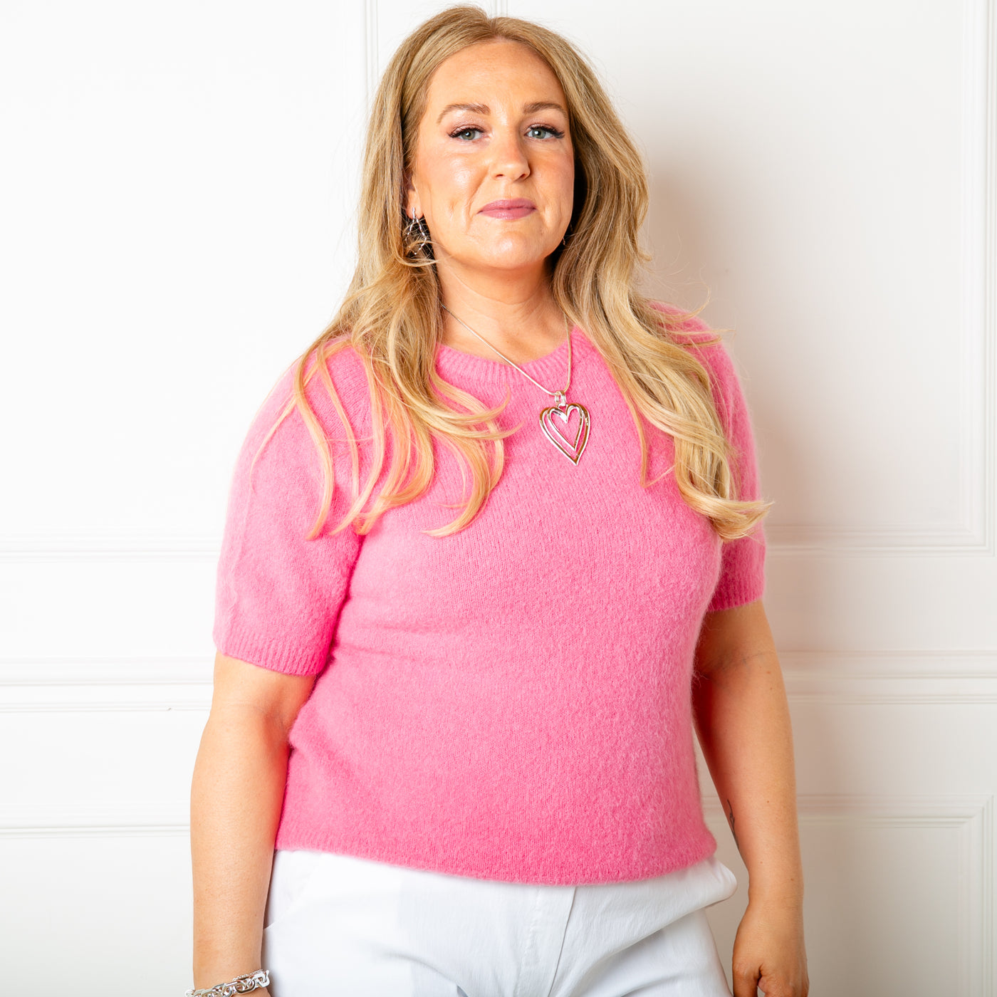 The watermelon pink Suri Alpaca Mix Short Sleeve Jumper with ribbed edges on the cuffs, neck and bottom hemline