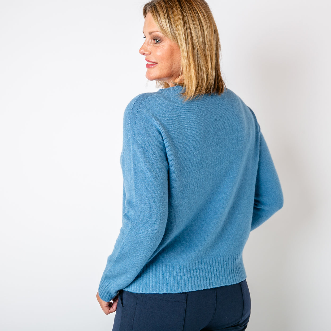 The denim blue Sweetheart Knitted Jumper with ribbed detailing on the cuffs and bottom hemline