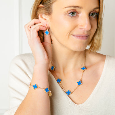 The blue Ivy Jewellery collection as a short necklace, earrings and bracelet all in the classic clover shape