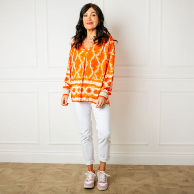 The orange Tie Dye Jersey Cuff Top with a v neckline made from a lightweight viscose material