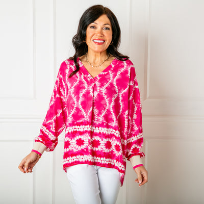 The fuchsia pink Tie Dye Jersey Cuff Top with long sleeves that have a stretchy contrasting cuff