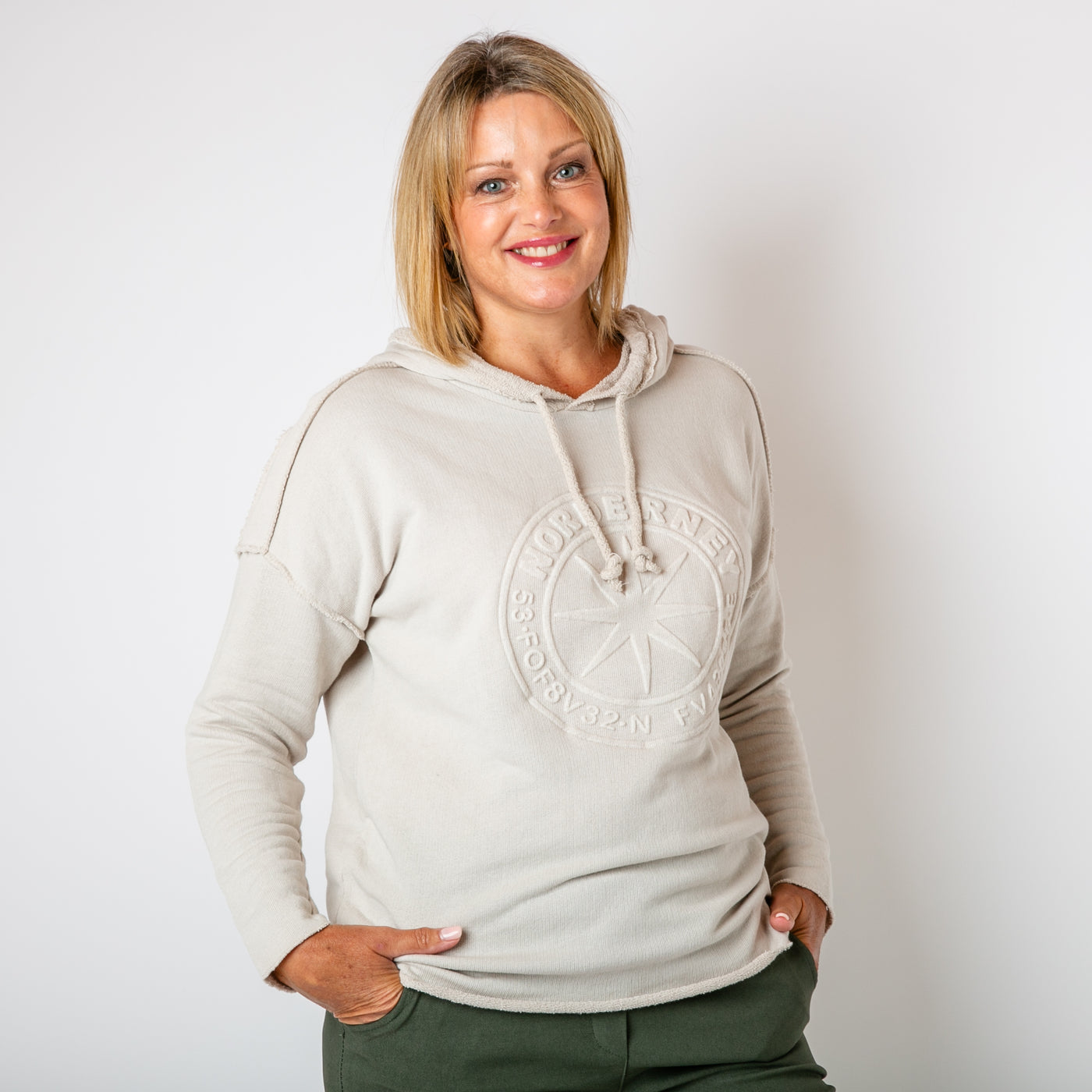 The stone cream Towelling Hoodie with long sleeves and a logo design on the front