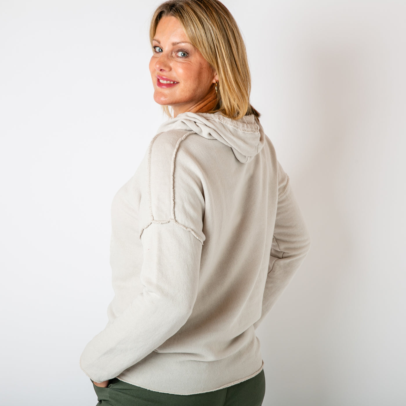 The stone cream Towelling Hoodie with a hood and drawstring detail which can be adjusted to suit