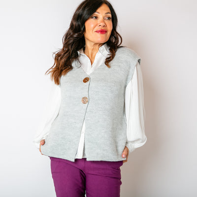 The Two Button Sleeveless Cardigan in silver grey with chunky, statement buttons down the front