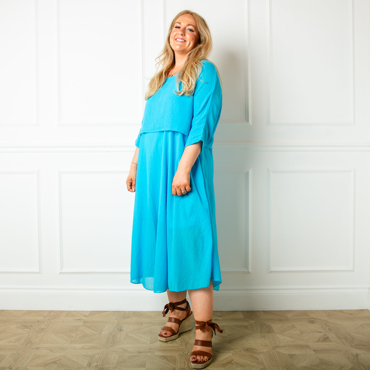 The aqua blue Two Piece Dress with a midi dress that has straps, a round neckline and a lining underneath
